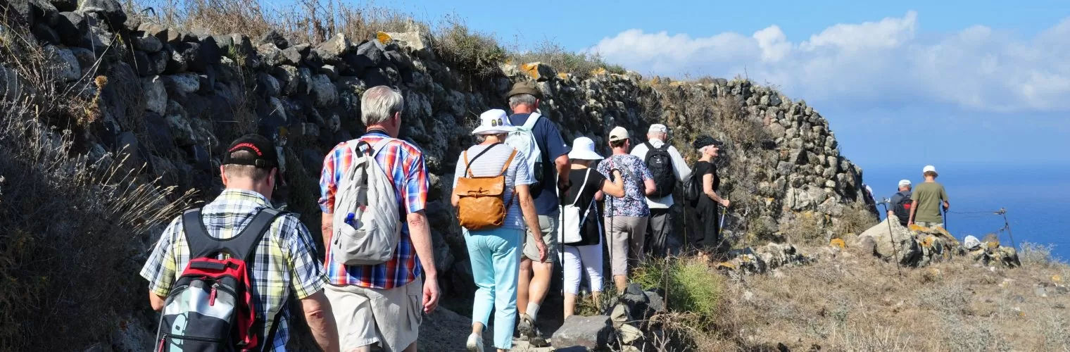 A group of people hiking during the Thirassia day trip from Santorini