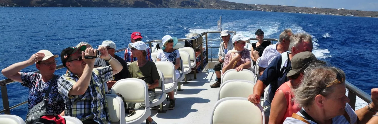 People on a boat taking a day trip from Santorini to Thirassia