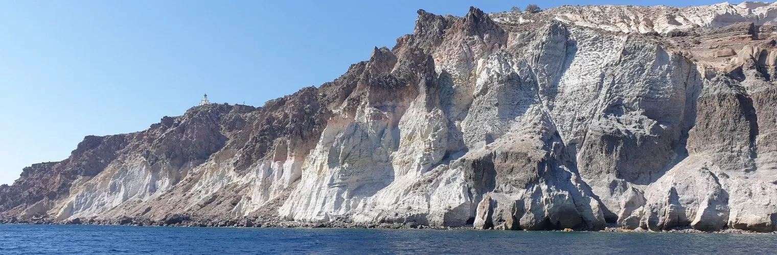 White volcanic cliffs as seen from the sea