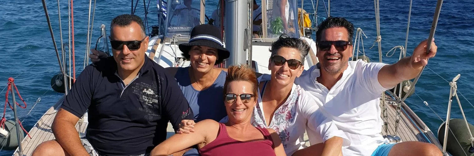 Tourists on a yacht during a Santorini half day cruise
