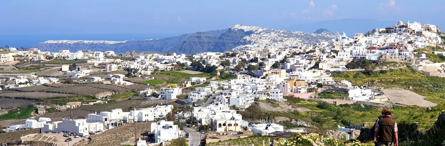 Panoramic view of white-washed houses in Santorini