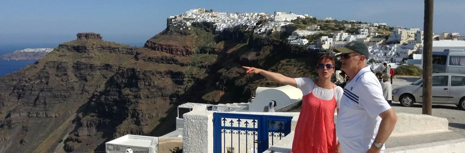 Tour guide speaking to a traveler during a Santorini private tour
