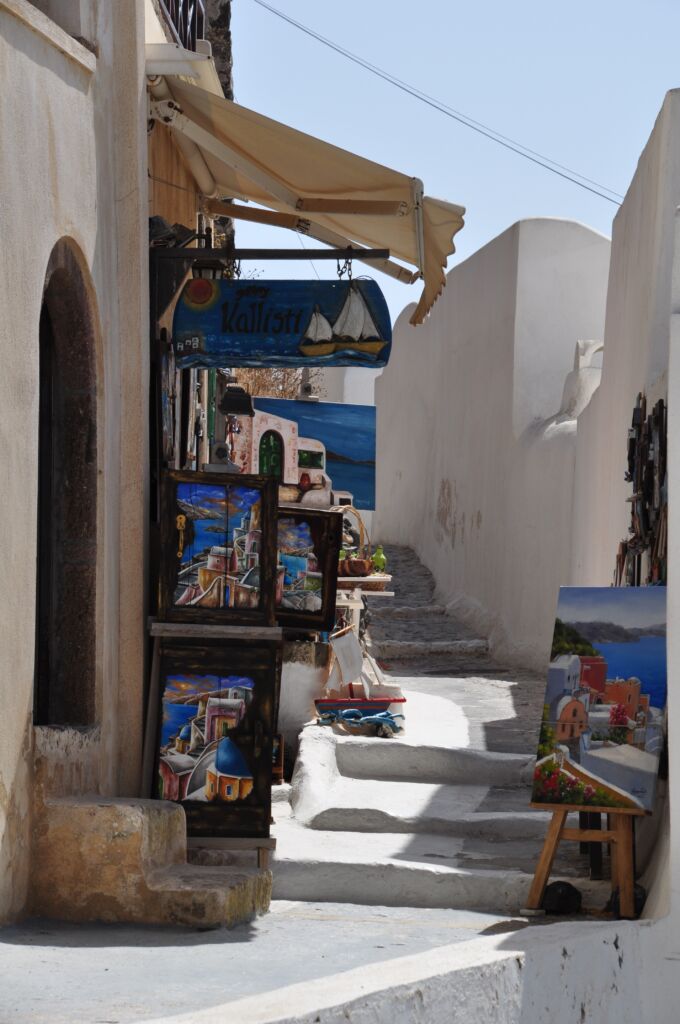 A souvenir shop with paintings in Pyrgos village, which is one of Santorini hidden gems