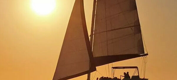 A sailing boat during a Santorini sunset cruise